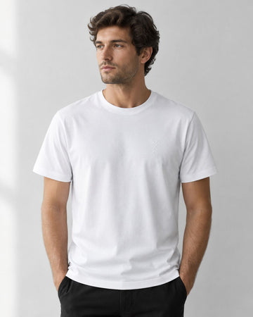 Model wearing a white DO WE crew-neck T-shirt, showing the shoulder seams and chest fit.